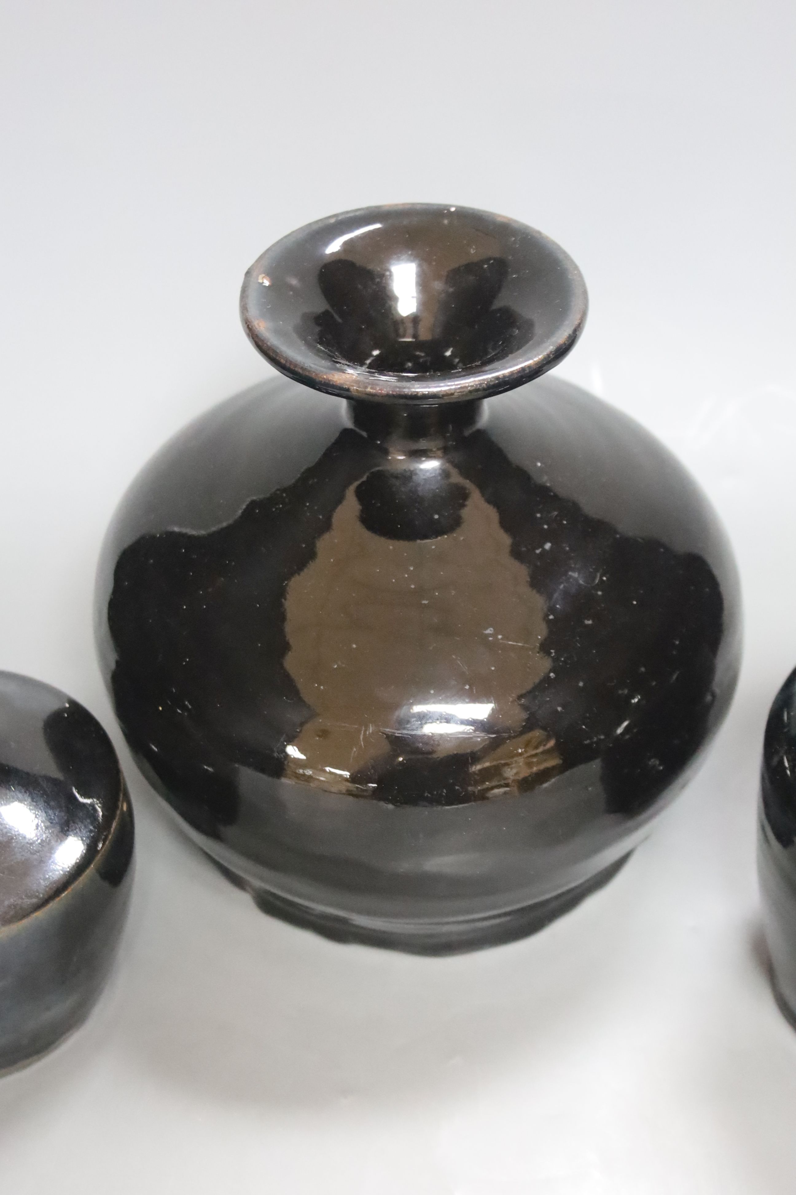 Three Chinese Shanxi black glazed jars, Qing dynasty, height 12 - 20cm